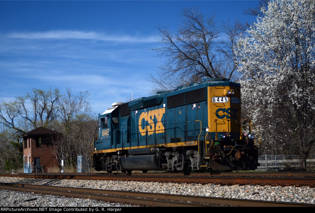 Evidence of an early spring is evident as L20505 heads west on track 1 past long-unused ND Cabin.